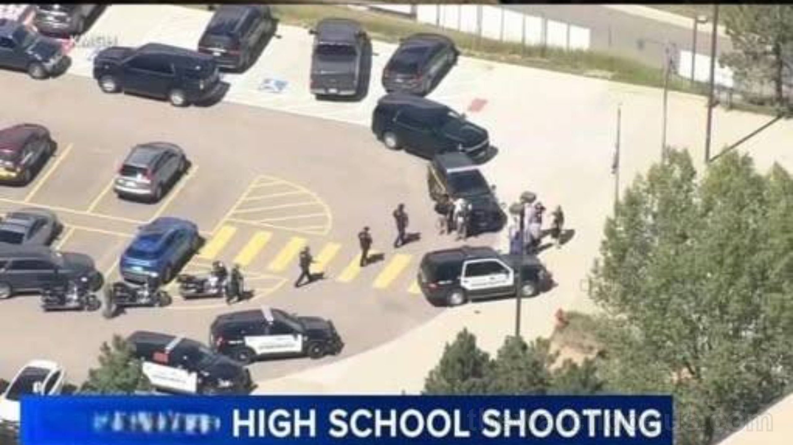 Emergency response at high school following Stockton shooting incident with police vehicles and students evacuated to safety