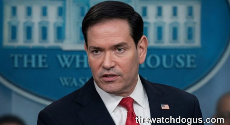 Official at White House podium discussing Iran Strait Hormuz negotiations and maritime security policy