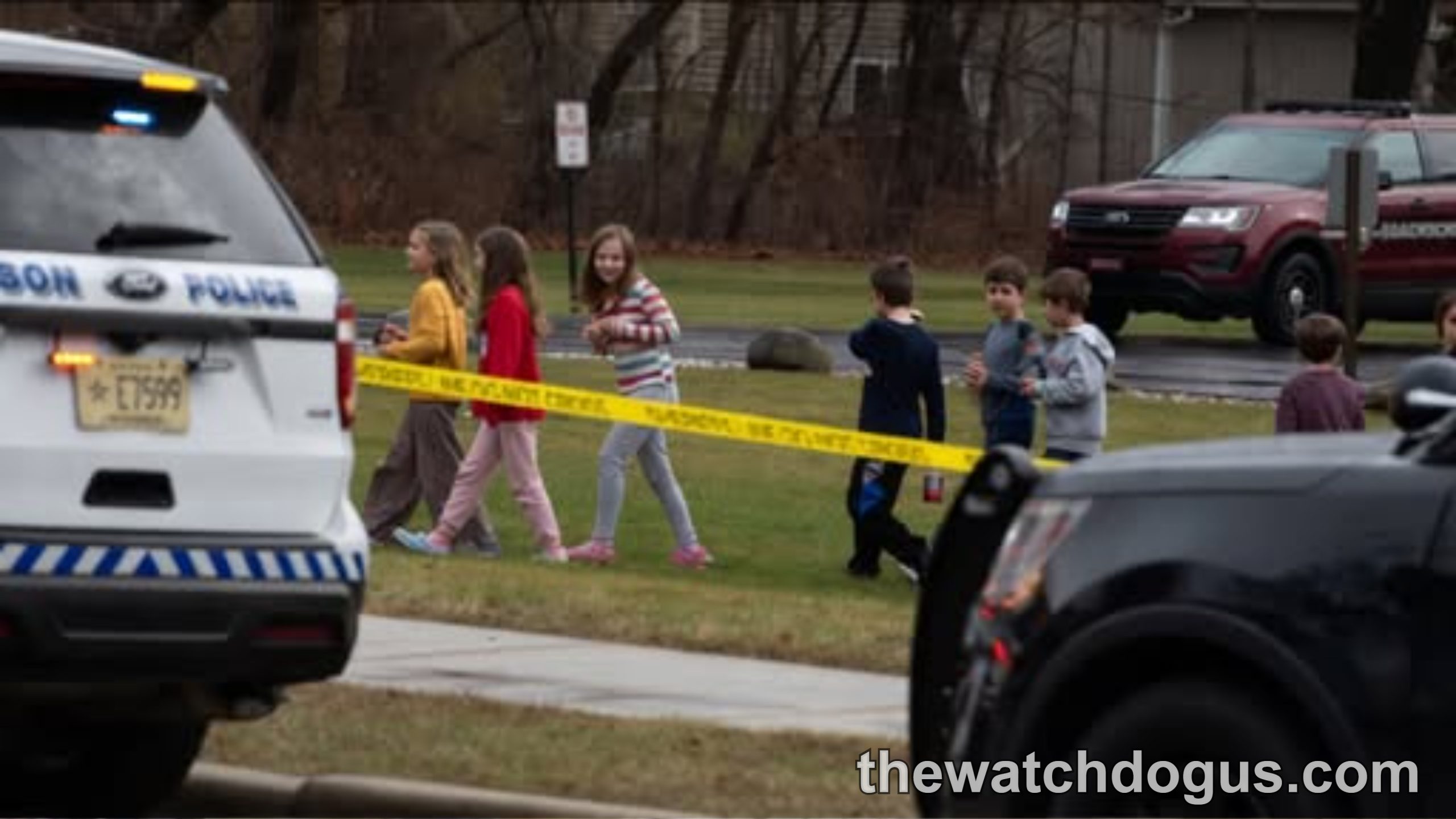 Police response to Stockton shooting incident at high school with emergency vehicles and yellow caution tape