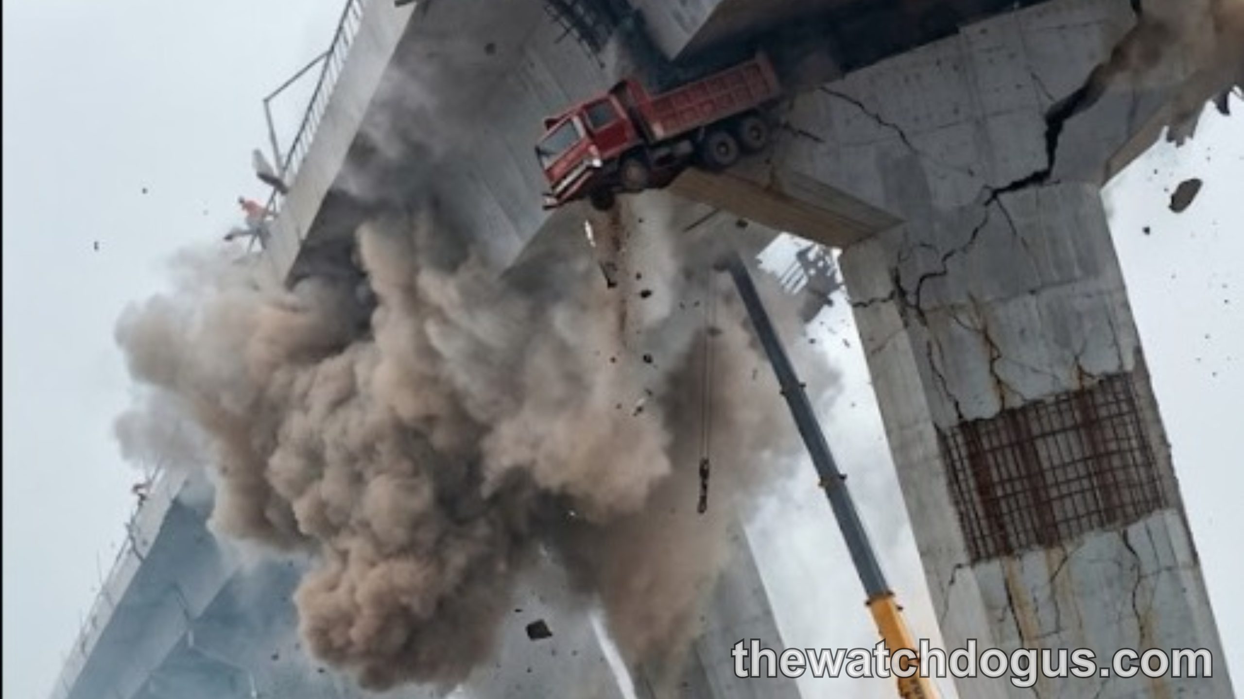 Massive concrete bridge collapse with red truck falling and dust cloud during Asia earthquake 7.7 disaster response