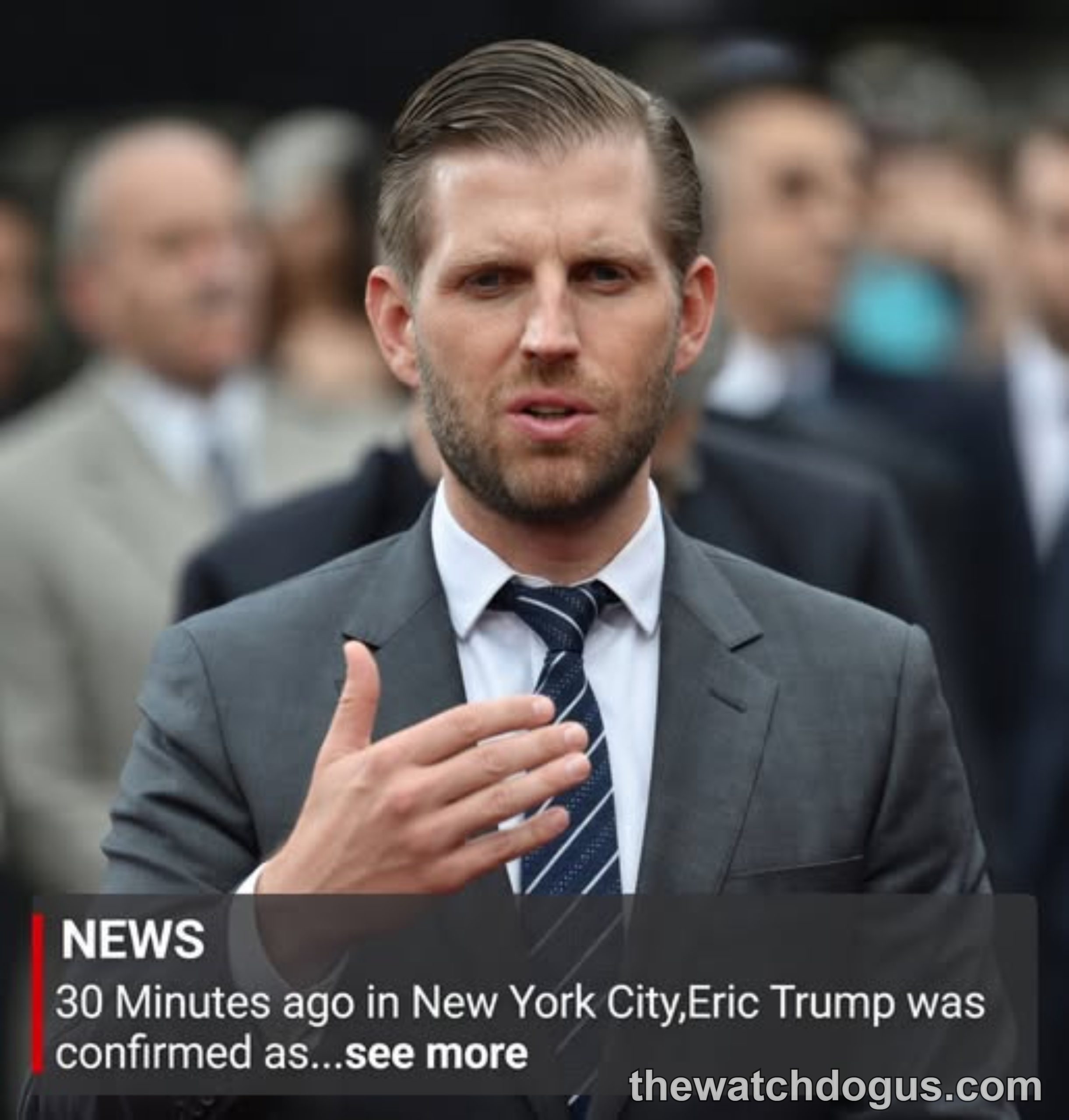 Eric Trump in gray suit and striped tie speaking at New York City event with confirmation news