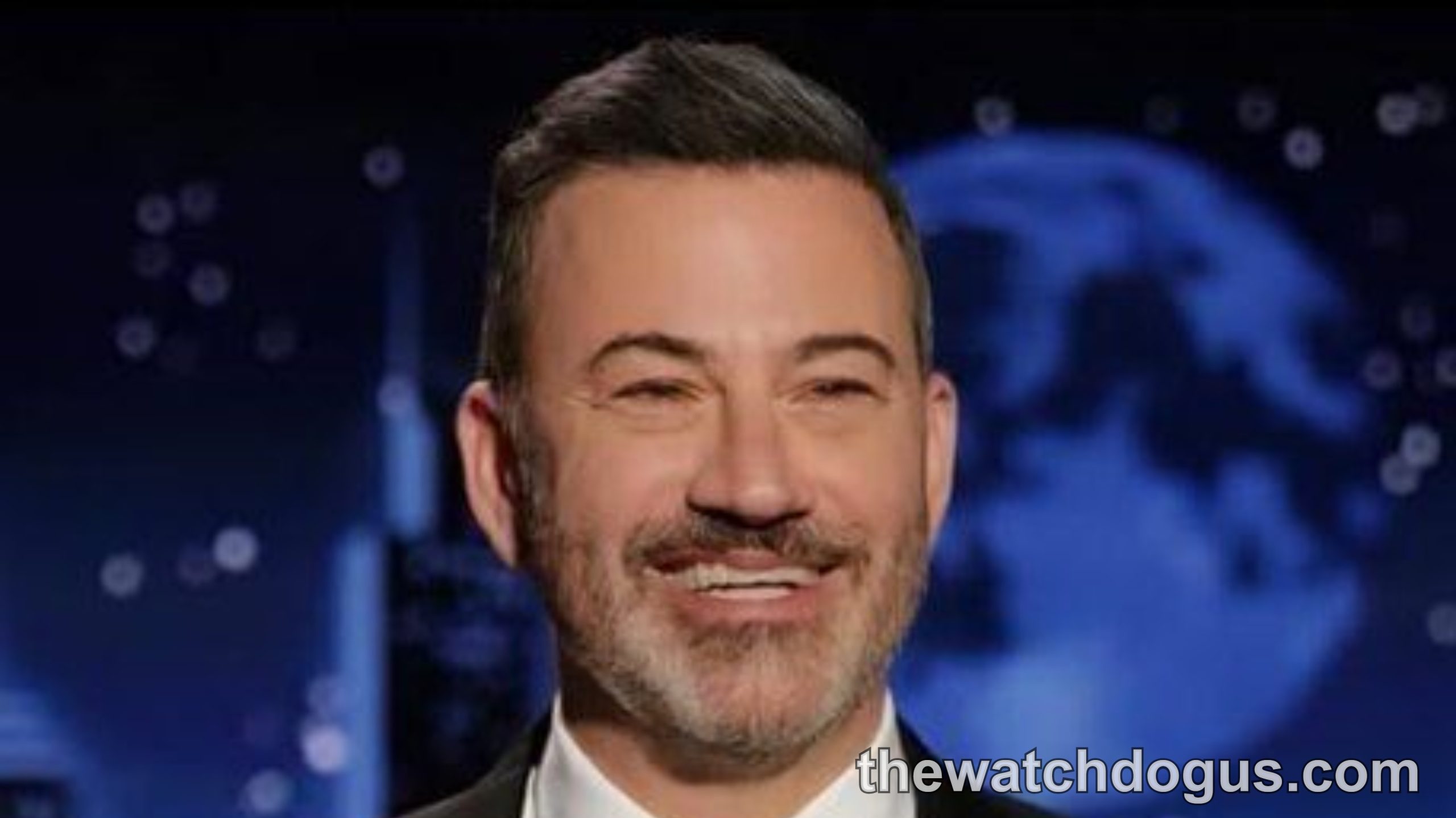 Jimmy Kimmel at news desk with breaking news alert, making Trump joke on late night show