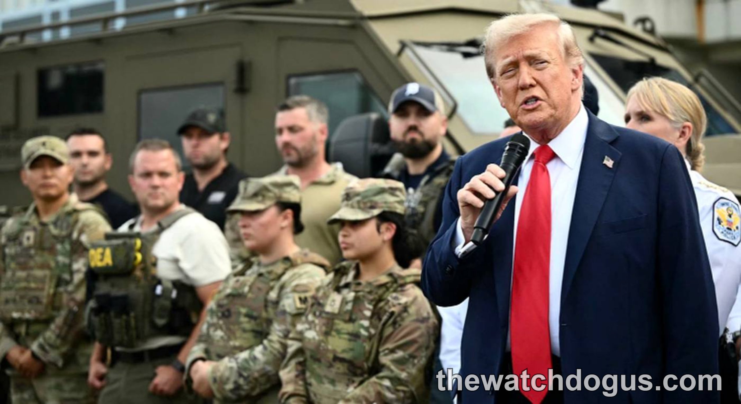 Political leader speaking to military personnel about Trump border policy enforcement operations