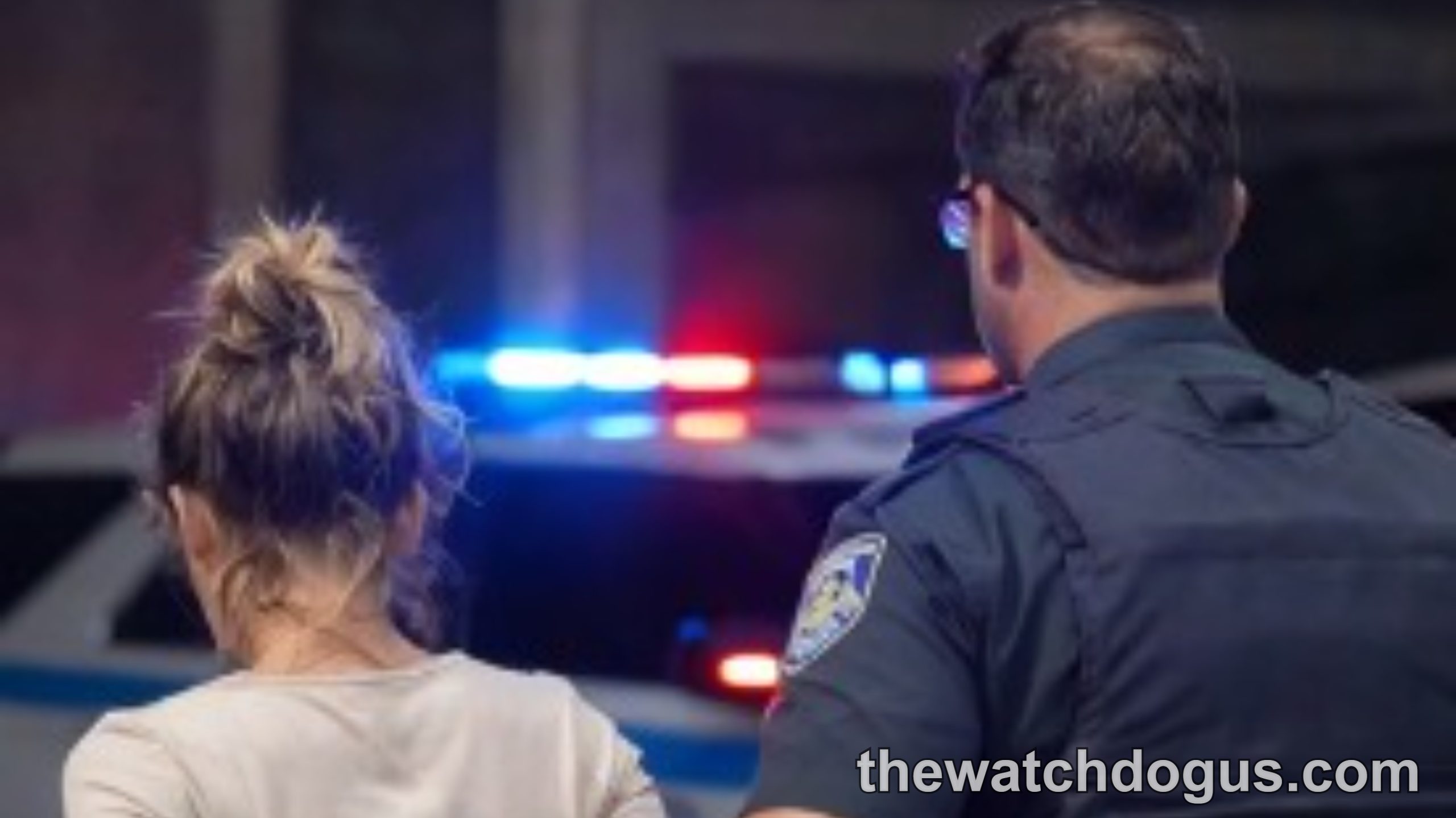 Police officer detaining woman in viral incident raising privacy concerns during nighttime street encounter