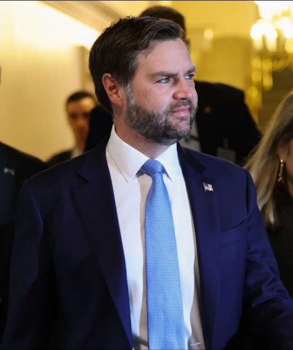 Official in dark suit and blue tie at White House security breach incident
