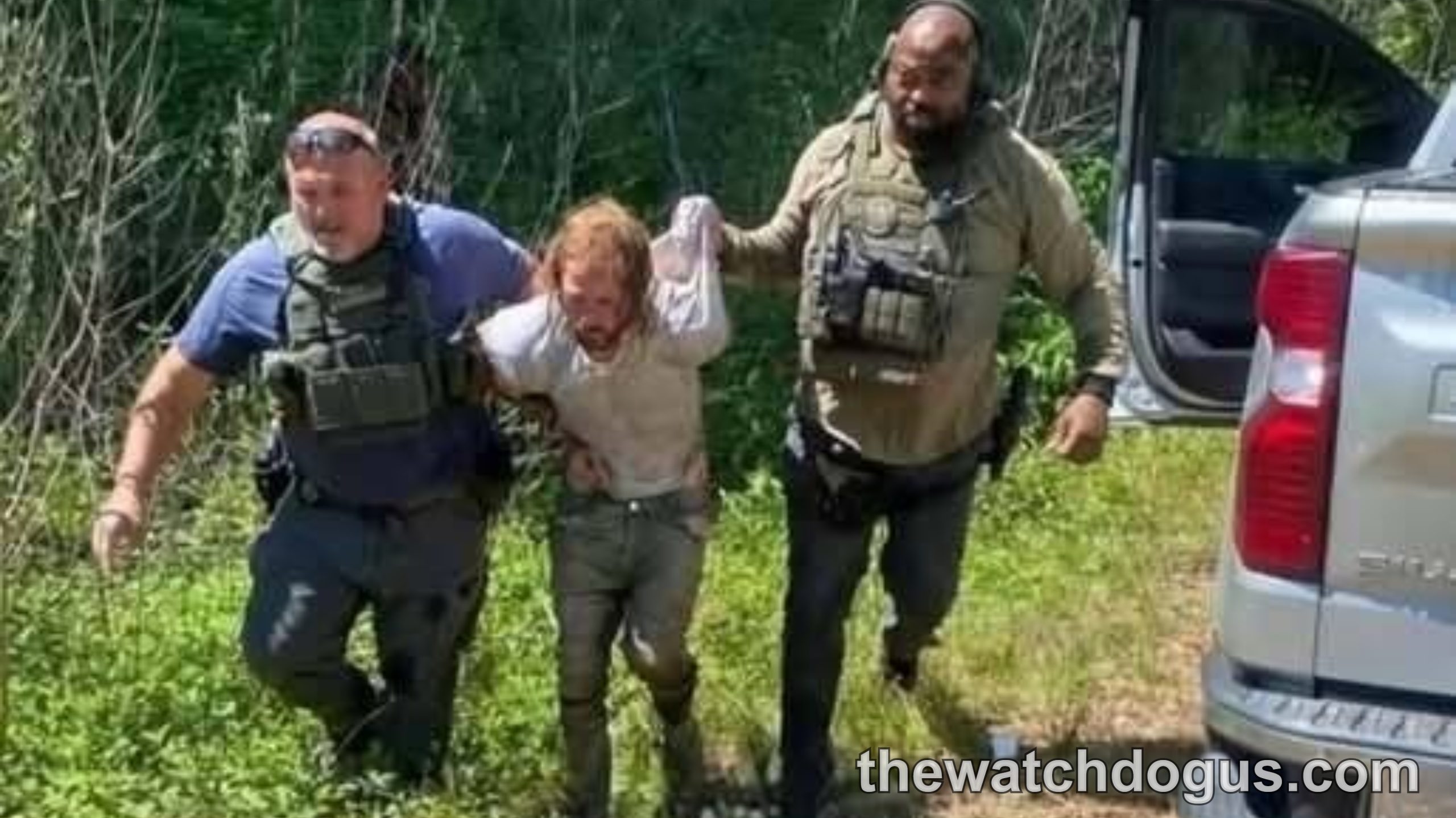 Father reunites with children after safety rescue operation with law enforcement officials and vehicle