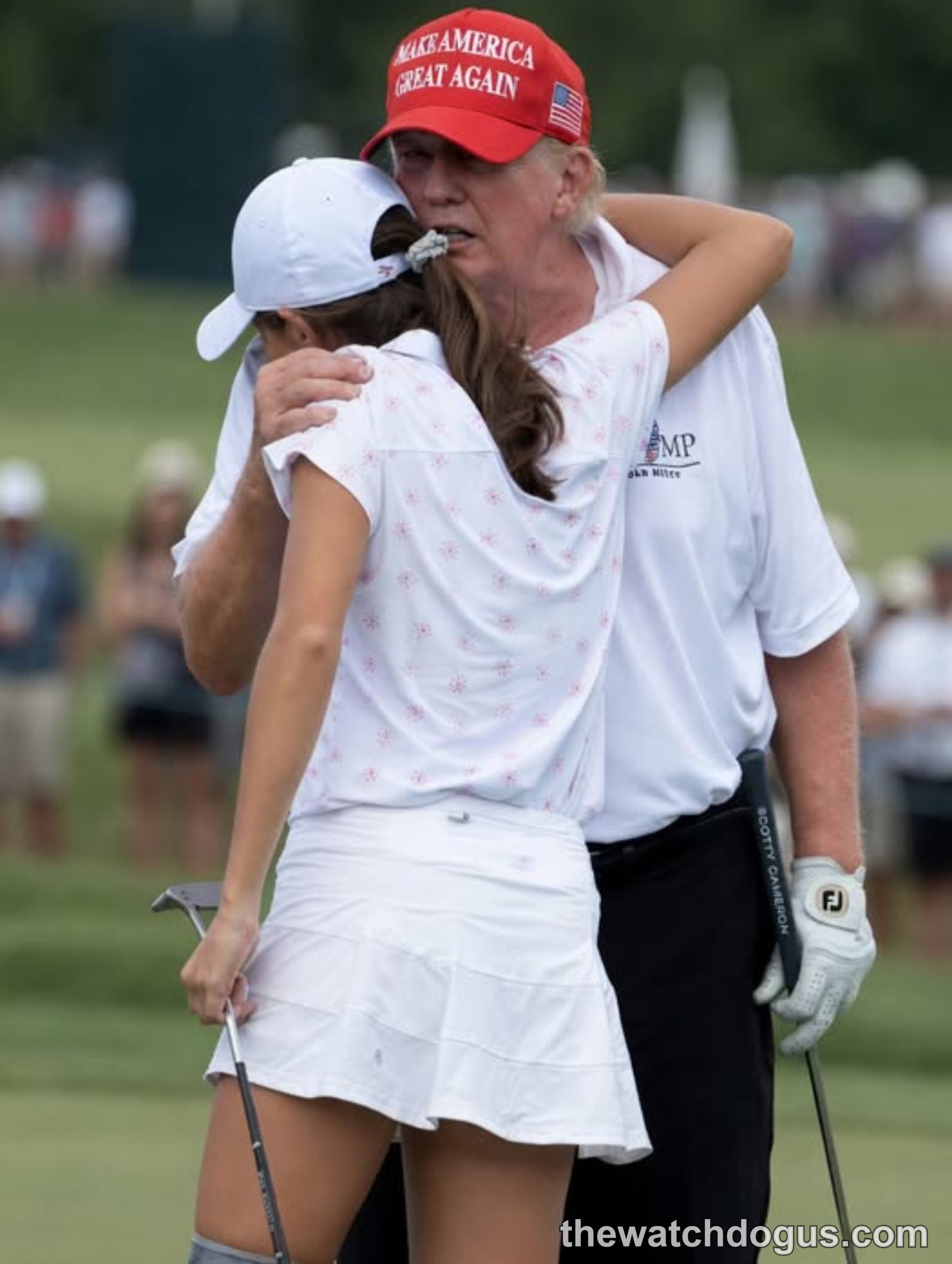 Kai Trump golfer receives a congratulatory embrace after her golf performance at a tournament event
