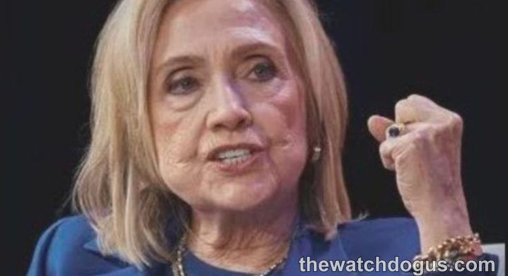 Woman speaking at podium discussing Clinton accountability and Trump during political address