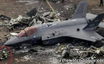 Navy aircraft crash debris scattered across ground with damaged drone fuselage in foreground
