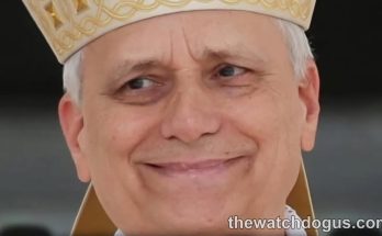 Pope Vatican official in ceremonial white and gold vestments with decorative mitre headpiece