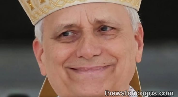 Pope Vatican official in ceremonial white and gold vestments with decorative mitre headpiece