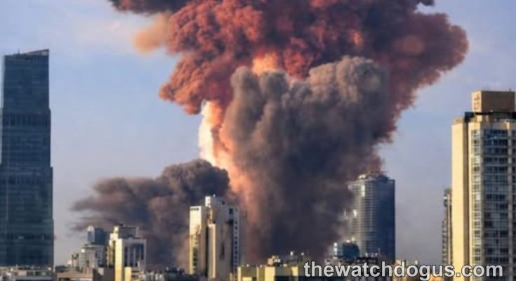 Large explosion with orange and red smoke clouds over urban cityscape during Israel Iran military campaign conflict