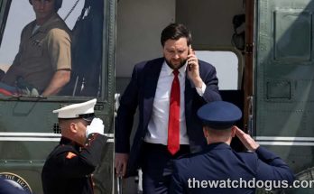 Official exiting helicopter during international diplomatic talks, surrounded by military personnel